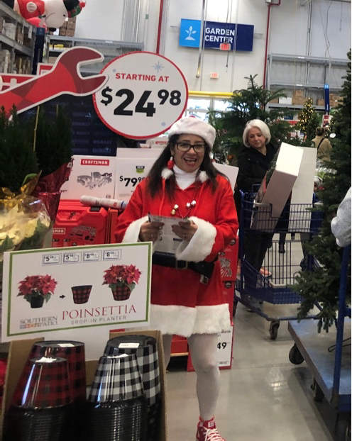 Mrs. Santa greeting customers