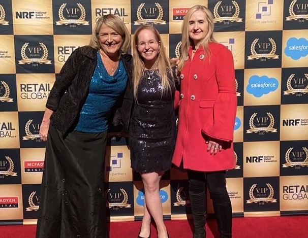 A group of women posing for a photo Description automatically generated with low confidence